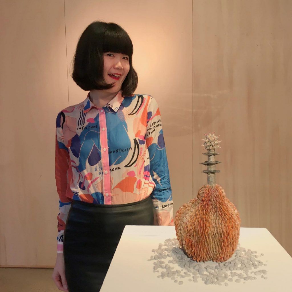 alt= Kaori Kurihara the Japanis artis with her artwork in Paris.