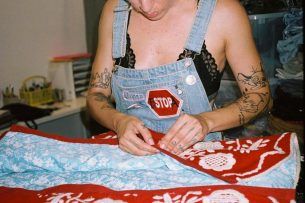 alt= photo artist woman with embroidered jacket