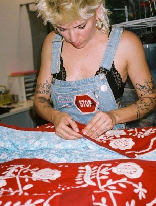 alt= photo artist woman with embroidered jacket