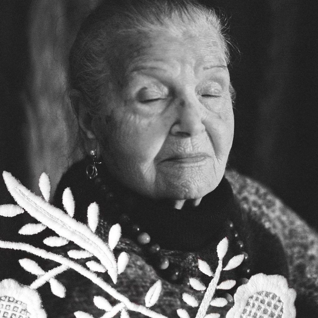 alt = grandmother with embrodery