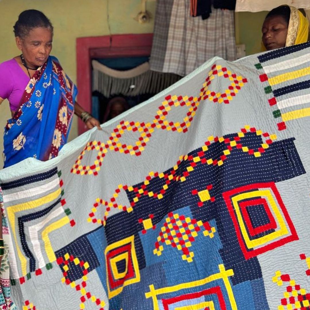 a;t= two woman Siddi textile