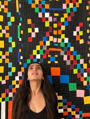 alt= woman photo with siddi quilt