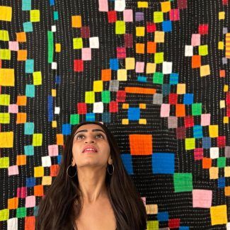 alt= woman photo with siddi quilt