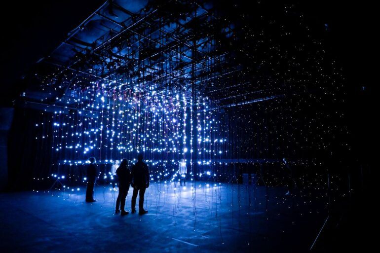 alt= Photo Installation NOWISWHENWEARE (the stars) Andrew Schneider at Rambert Studio.